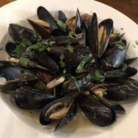 Mussels Luciano · Steamed in a white wine and marinara sauce. Served over linguine.