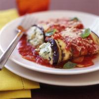 Eggplant Rollatini · Grilled eggplant rolled up and stuffed with ricotta cheese, topped with marinara sauce and m...