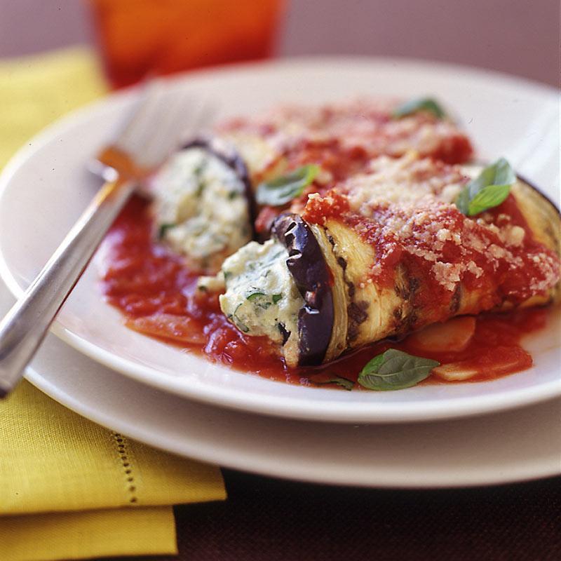 Eggplant Rollatini · grilled eggplant rolled up and stuffed with ricotta cheese,topped with marinara sauce and melted mozzarella cheese