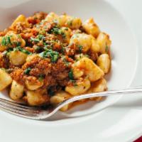 Gnocchi Bolognese · Potato dumpling in a classic meat sauce with a touch of cream.