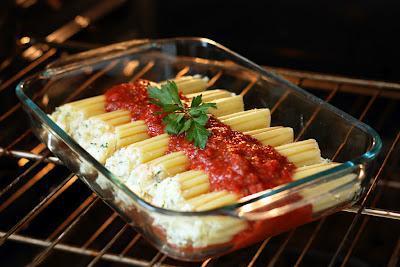 Homemade Manicotti · Pasta crepe stuffed with dabs of ricotta cheese, topped with marinara sauce.