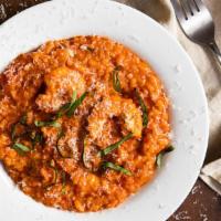 Risotto · Aborio rice with shrimp, clams, and mussels in tomato cream sauce.