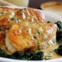 Chicken Florentine · Breast of chicken topped with prosciutto and provolone in a spinach cream sauce. Served with...