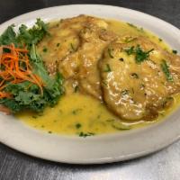 Chicken Francese · Egg-dipped breast of chicken in butter lemon sauce and white wine. Served with vegetables of...