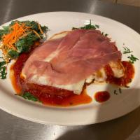 Chicken ala Bartlino · Breasted breast of chicken cutlet topped with prosciutto, tomato sauce, and mozzarella chees...