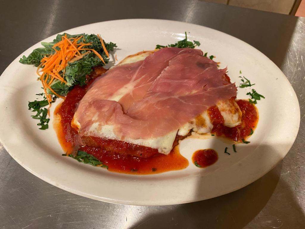 Chicken ala Bartlino · Breasted breast of chicken cutlet topped with prosciutto, tomato sauce, and mozzarella cheese. Served with vegetables of the day.