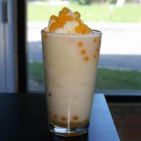 Coco Loco · Pineapple coconut smoothie with mango popping boba.
