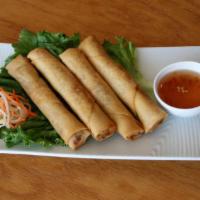 003. Fried Vietnamese Spring Rolls · 4 pieces. Delicate fried wrapper with a mix of carrot, taro, wood ear, onion, and bean vermi...