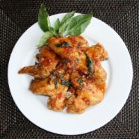 Thai Sweet Chili Wings · 5 pieces. Crispy jumbo wings coated in a sweet chili and basil sauce. Spicy.