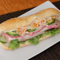 Ham Sandwich · Banh mi thit nguoi. Assorted Vietnamese ham, barbecue pork, and butter, served on a toasted ...