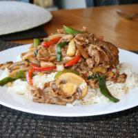 Beef Teriyaki over Baked Rice · Thinly sliced teriyaki beef stir fried with bell peppers, mushrooms, and onion, served over ...