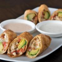 Avocado Club Egg Rolls · Hand-wrapped crispy wonton rolls filled with avocado, chicken, tomato, Monterey Jack and Nue...