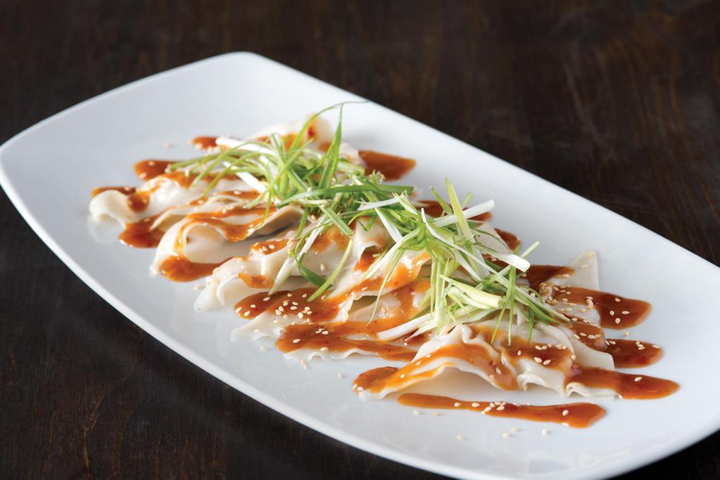 Szechuan Chicken Dumplings  · Topped with fresh cilantro, sesame seeds and scallions. Served with our soy-ginger chili sauce.