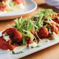 Spicy Buffalo Cauliflower · Fresh cauliflower florets buttermilk-battered and fried to a golden brown, then tossed in ho...