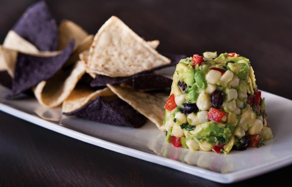 White Corn Guacamole and Chips Plate  · Diced avocado, sweet corn, black beans, jicama, bell peppers, fresh cilantro, and Serrano peppers. Served with housemade blue and white corn tortilla chips. Vegetarian.