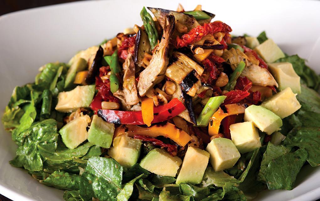 Roasted Veggie Salad · Warm artichoke hearts, asparagus, eggplant, red and yellow peppers, corn and sun-dried tomatoes served over cool romaine, avocado and house made Dijon balsamic vinaigrette. Vegetarian.