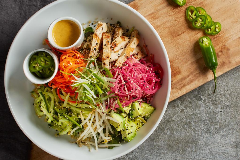 Banh Mi Bowl  · Quinoa, baby kale, fresh cilantro and mint topped with grilled chicken, watermelon radishes, fresh avocado, cucumbers, carrots, bean sprouts, scallions and sesame seeds. Served with housemade chili-lime vinaigrette and serrano peppers. Gluten free ingredients.