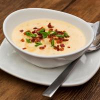 Baked Potato Soup · With Nueske's applewood smoked bacon and scallions.