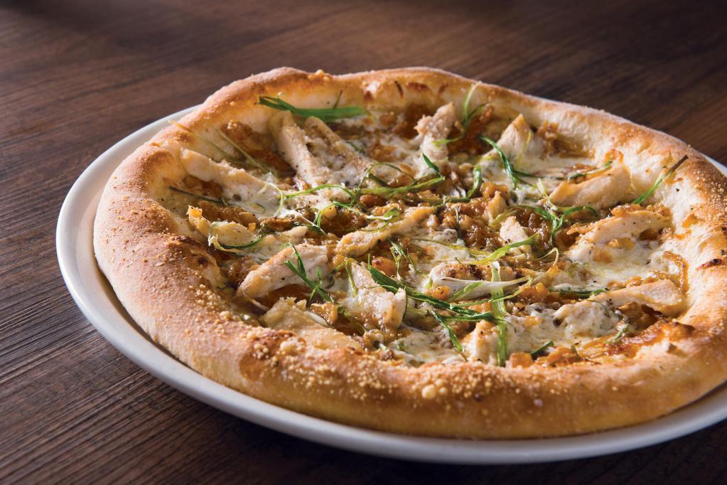 Roasted Garlic Chicken Pizza  · Sweet caramelized onions, fresh mozzarella, Parmesan, slivered scallions and cracked black pepper.