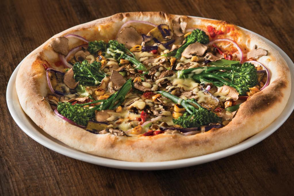 California Veggie Pizza · Broccolini, eggplant, cremini mushrooms, sun-dried tomatoes, roasted corn, red onions and mozzarella. Vegetarian.