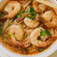 Tom Yum Noodle Soup · Thai hot and sour soup with rice noodle, scallion, bean sprout and top with shrimp.