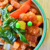 Crispy Chicken Basil · Crispy chicken topped with onion, red and green pepper, carrot, pineapple, green pea and bas...