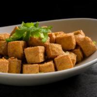Fried Tofu · Deep fried soft tofu seasoned and served with a tangy chili sauce.