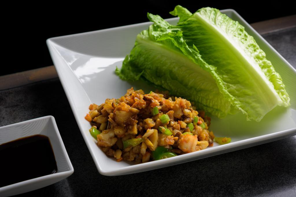 Lettuce Wrap · Lettuce wrap with radish, carrots and water chestnut with choice of chicken or shrimp, all tossed in special house sauce.
