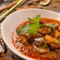 Burmese Eggplant Curry · Fried eggplant curried with onion, garlic and ginger. Spicy.