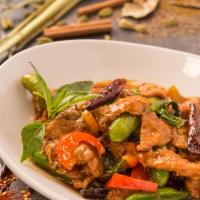 Rangoon Lemongrass Pork · Wok tossed with chili, garlic, soy sauce, fish sauce, snap peas, red bell peppers and lemong...
