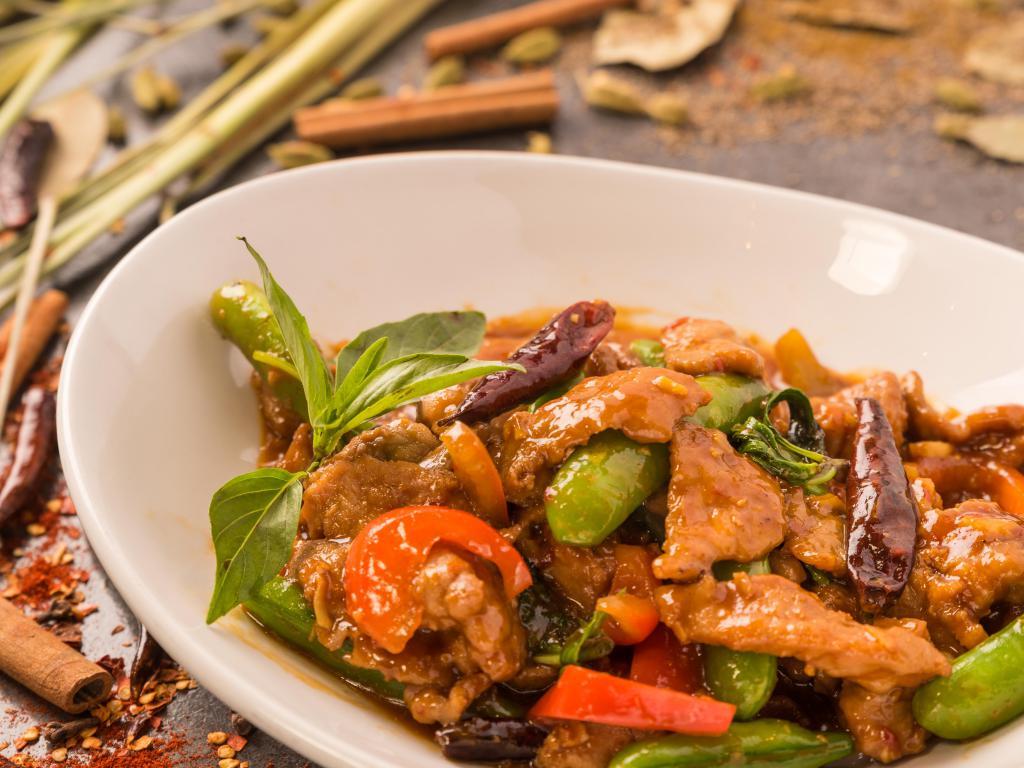 Rangoon Lemongrass Pork · Wok tossed with chili, garlic, soy sauce, fish sauce, snap peas, red bell peppers and lemongrass; finished with fresh basil. Spicy.