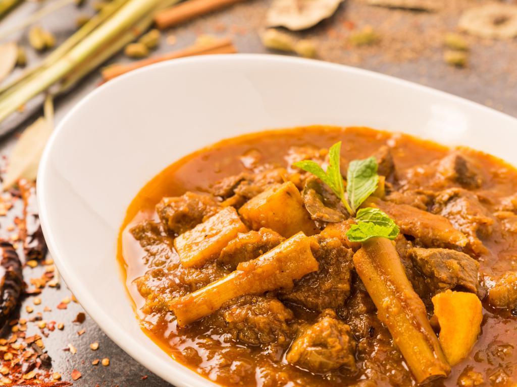 Country Style Lamb · Lamb in Bagan's traditional curry with onion, garlic and red chili. Spicy.