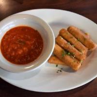Mozzarella Fritti · Fresh-cut Wisconsin mozzarella lightly breaded and fried to a golden brown. Served with Russ...