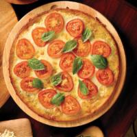 Margarita Pizza · Roma tomatoes, fresh basil, garlic, Wisconsin mozzarella and Sicilian extra virgin olive oil.