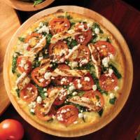 Chicken Rustica Pizza · Grilled chicken with spinach, basil, feta cheese, Roma tomatoes, Wisconsin mozzarella and Si...