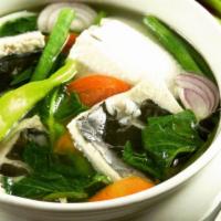 B7. Sinigang Na Belly Ng Bangus Soup · Milkfish, tamarind soup and Asian vegetables.