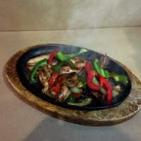 H2. Sizzling Squid · Stir-fried squid served on a hot plate. 