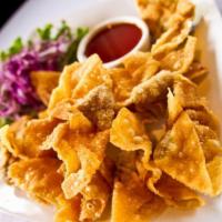 Fried Wontons · Stuffed with flavorful ground pork, these crispy-fried wontons are served with sweet plum sa...