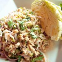 Larb Salad · Distinctively Thai, this dish blends red onions, green onions, cilantro, chili, lime juice, ...