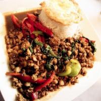 Pad Ka Prau · This dish features your choice of ground chicken or pork stir-fried with basil and bell pepp...