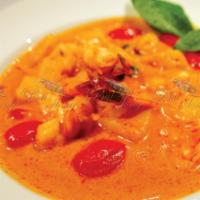 Pineapple Prawn Curry · This dish features pineapple, grape tomatoes, basil, and bell peppers, with succulent prawns...