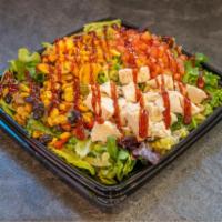 BBQ Chicken Salad · Slow roasted chicken, mixed greens, crispy cheddar onions, diced tomatoes, corn and black be...