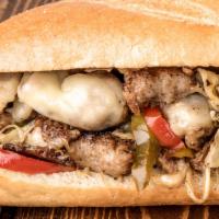 Italian Sausage Hot Sub · Italian sausage grilled with mushrooms, sweet peppers, onions and provolone cheese topped wi...