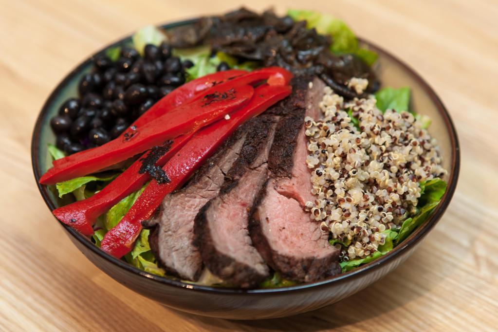 Argentine Steakhouse · Grilled USDA choice flank steak, roasted red peppers, grilled red onions, organic tri-color quinoa, black beans, romaine and arugula; chimichurri vinaigrette.