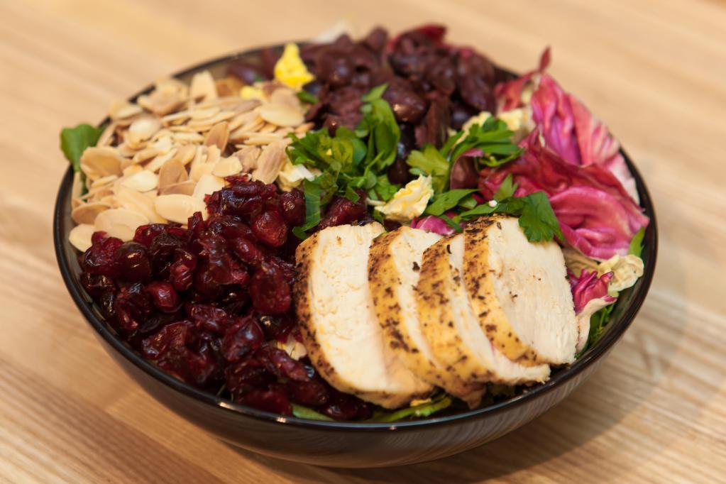 Sienna Salad · All natural grilled chicken, radicchio, Kalamata olives, Italian parsley, toasted almonds, dried cranberries, Napa cabbage and baby kale; lemon creole mustard vinaigrette.