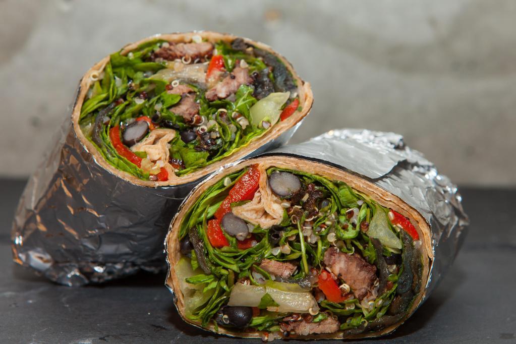 Argentine Steakhouse Wrap · Grilled USDA choice flank steak, roasted red peppers, grilled red onions, organic tri-color quinoa, black beans, romaine and arugula; chimichurri vinaigrette.