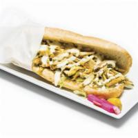 Chicken Shawarma Sandwich · With garlic aioli. Served with lettuce, tomato, pickles, sauce and choice of French roll, pi...