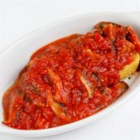 Polenta Grigliata · Grilled polenta, sauteed mushrooms and fresh tomato.