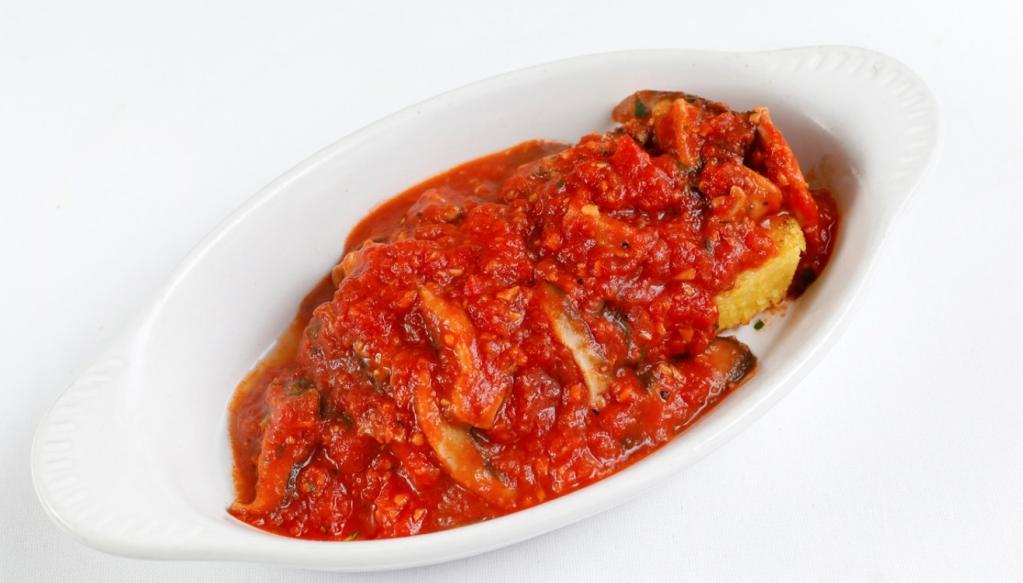 Polenta Grigliata · Grilled polenta, sauteed mushrooms and fresh tomato.