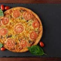Vegan Margarita · Vegan Al Dente pizza sauce • Fresh Basil • Daiya Mozzarella Cheese • Sliced Tomatoes